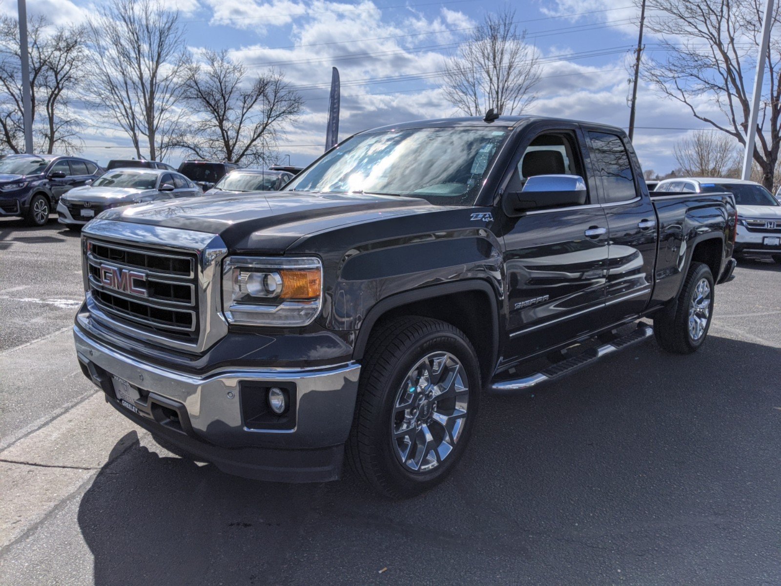 Pre-Owned 2014 GMC Sierra 1500 SLT Extended Cab Pickup in Greeley #